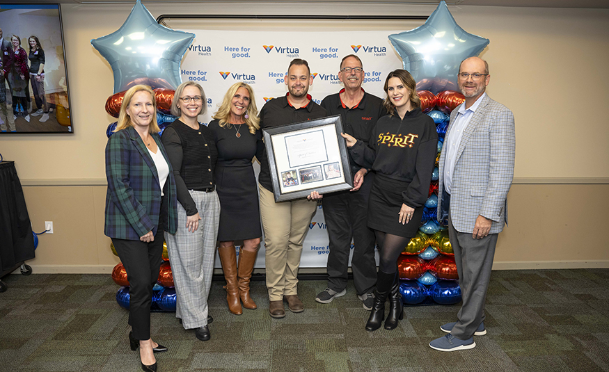Representatives from Virtua Health and Spirit Halloween commemorate more than $1 million in donations to child-life services at Virtua hospitals.
